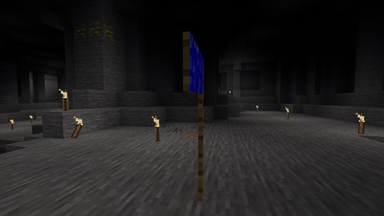 Screenshot of a voxel cavern light by torches. In the center, there's a blue flag.