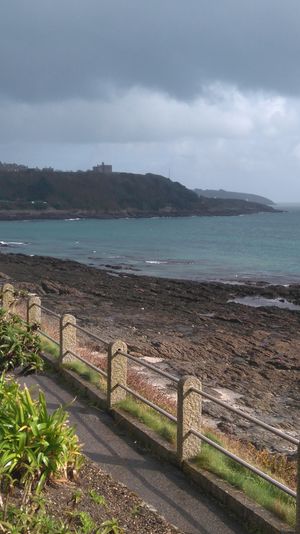 A coastal footpath in Falmouth, Cornwall. I love the contrast between the sunlight in the foreground and the dark background.