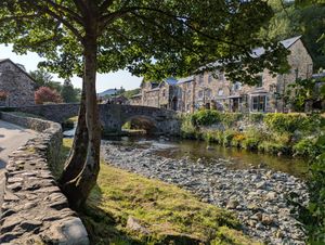A river and bridge in a small village in Wales.