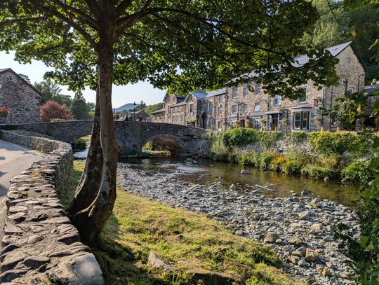 A river and bridge in a small village in Wales.