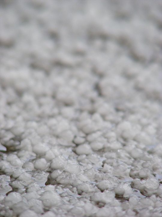 Hail on a driveway. This is the background of my profile picture.