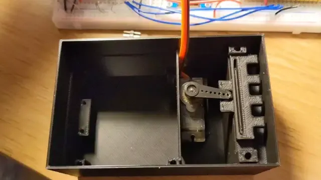Servo-based lock design using E-shaped gripper.